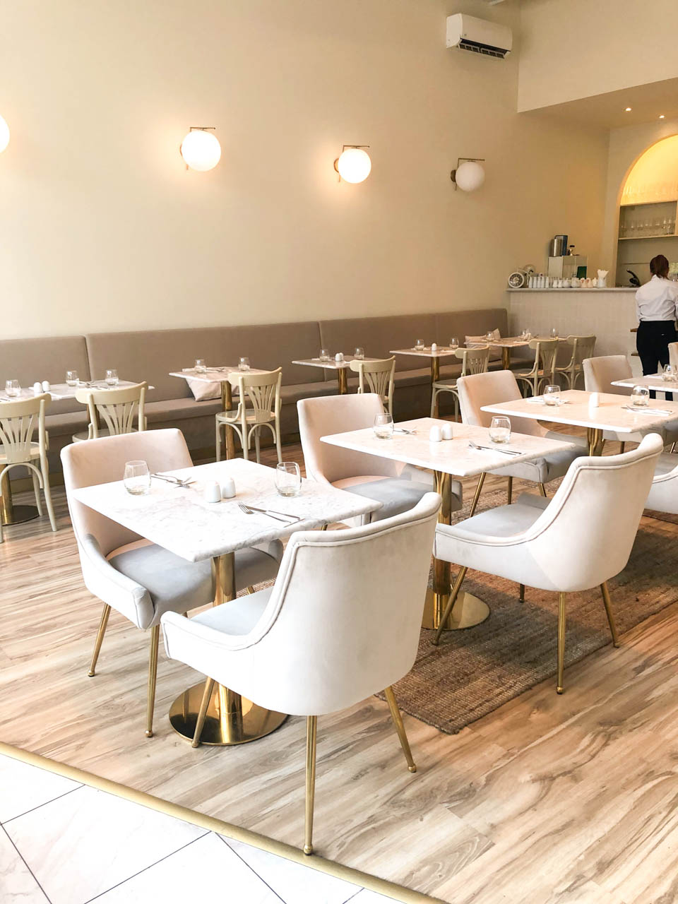 Tables inside the Á la Maison restaurant in Budapest, Hungary
