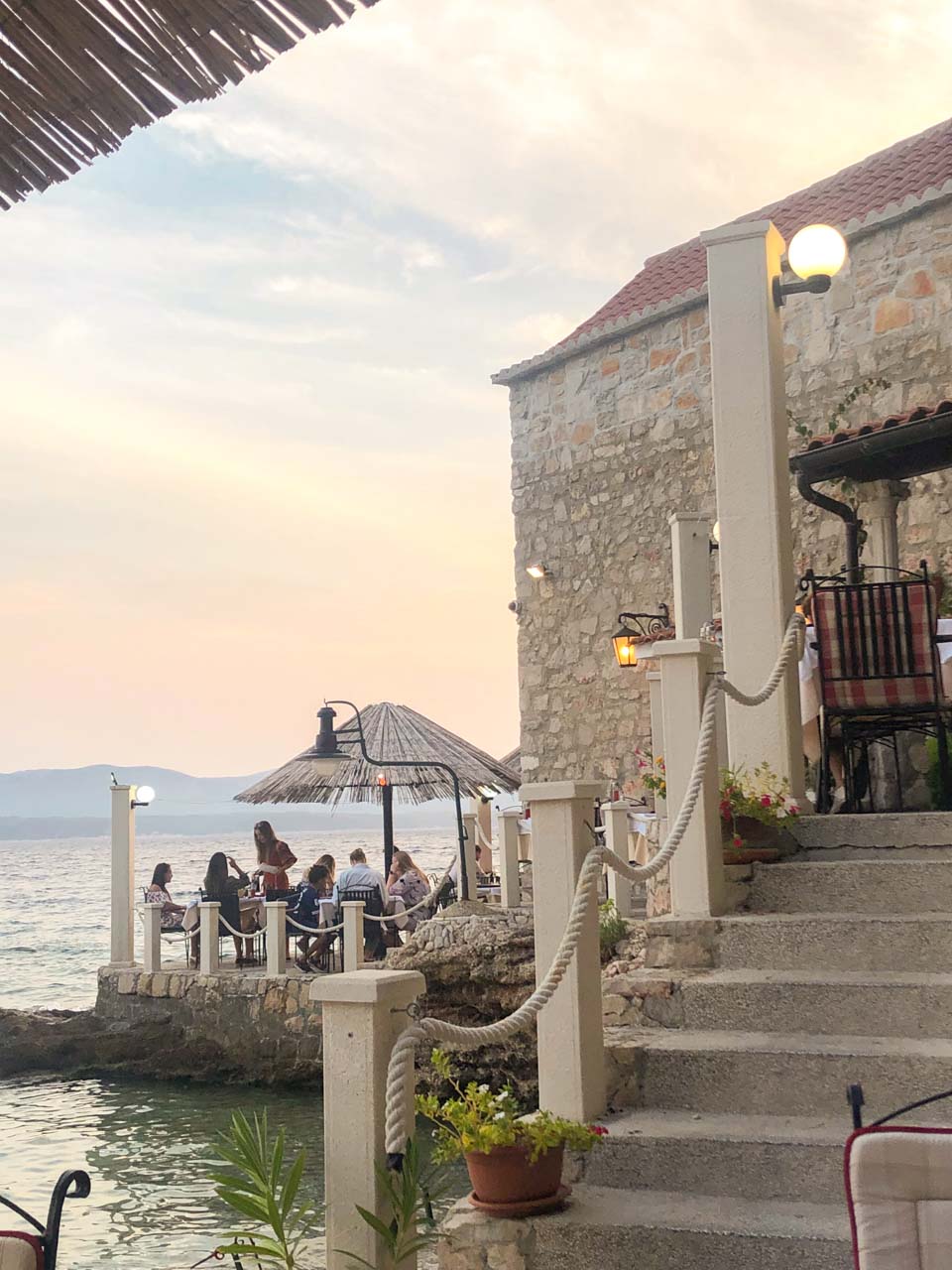 The outdoor terrace of the Ribarska Kućica restaurant in Bol, Croatia