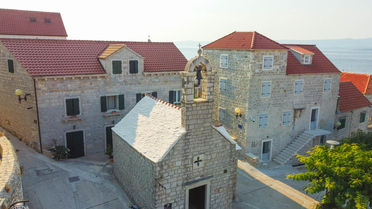 Old stone chapel in Bol, Croatia seen from above