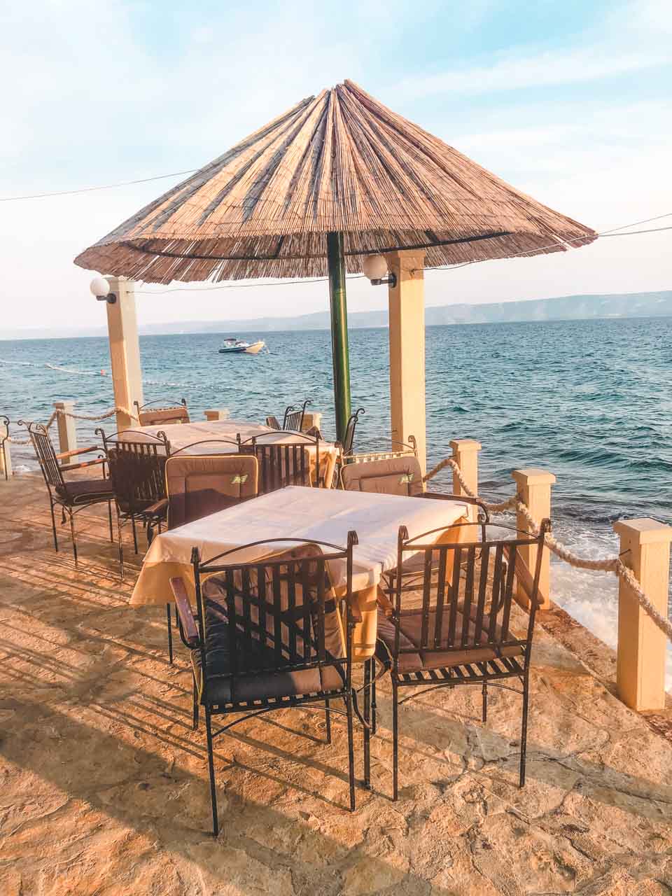 Seafront tables at the Ribarska Kućica restaurant in Bol, Croatia