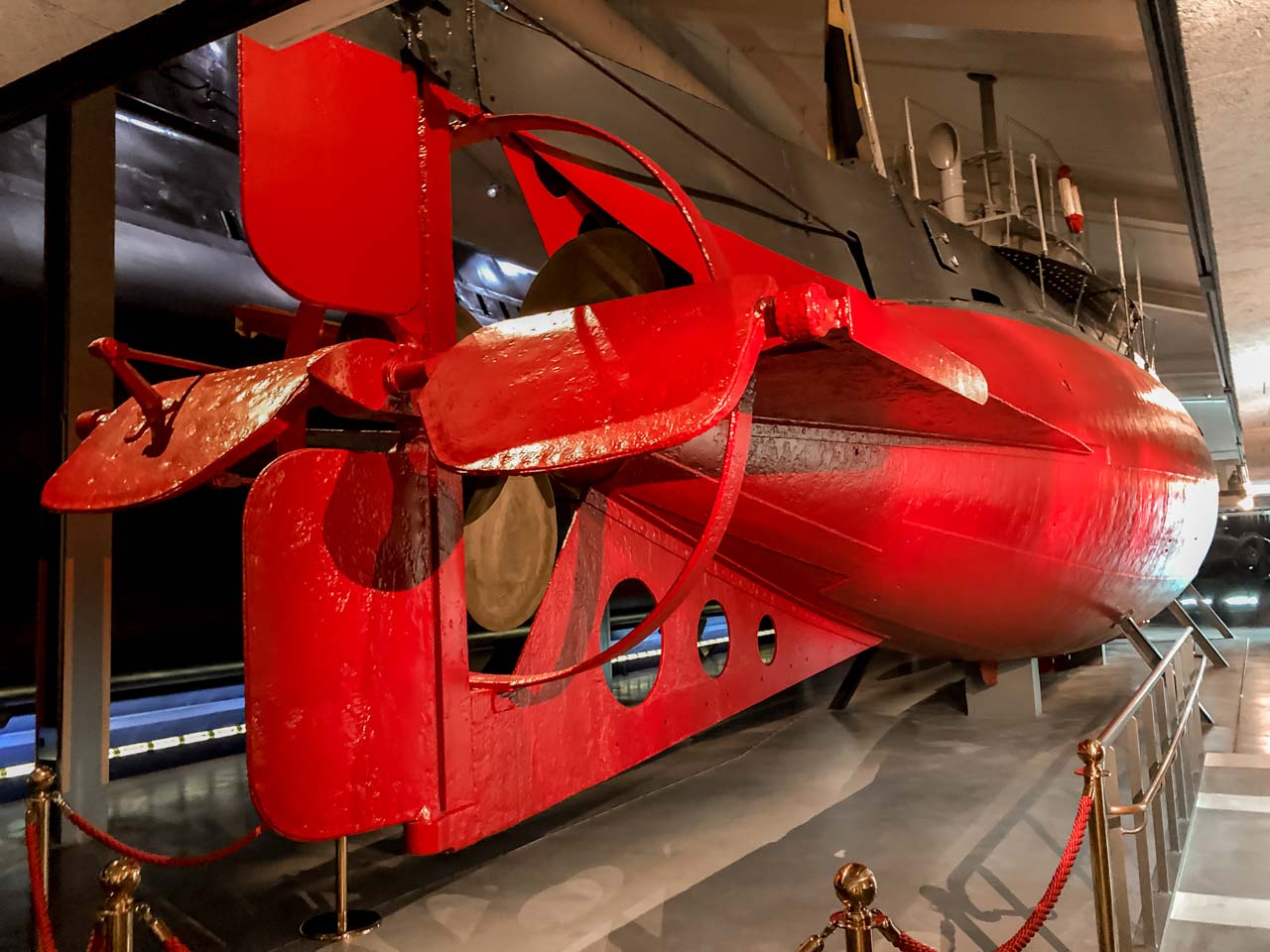 A red submarine inside the Submarine Hall at Marinmuseum in Karlskrona