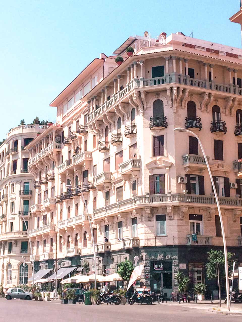 A pastel pink building in Naples, Italy
