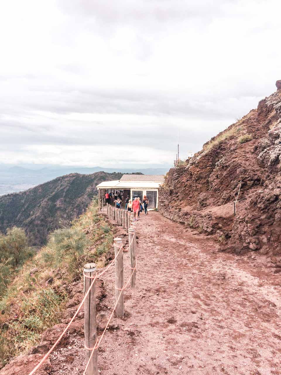 People walking on the trail leading towards the summit of Mount Vesuvius