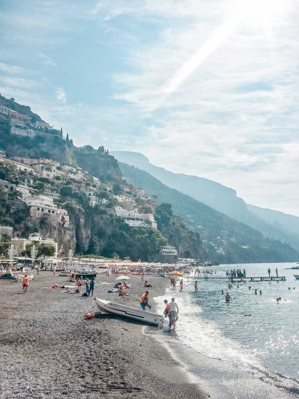 Tourists on the beach in Positano, Italy