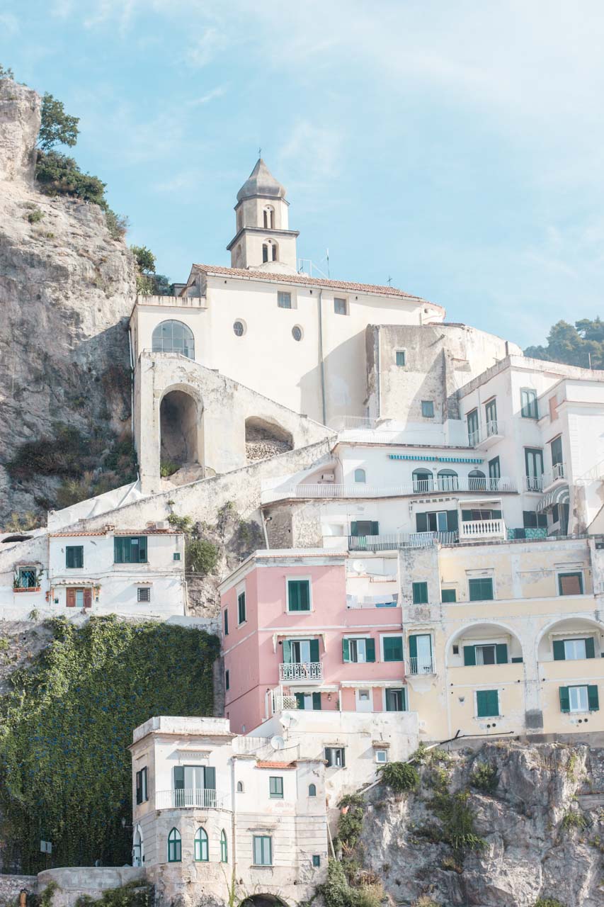 A close-up photo of the pastel hillside buildings in Positano, Italy