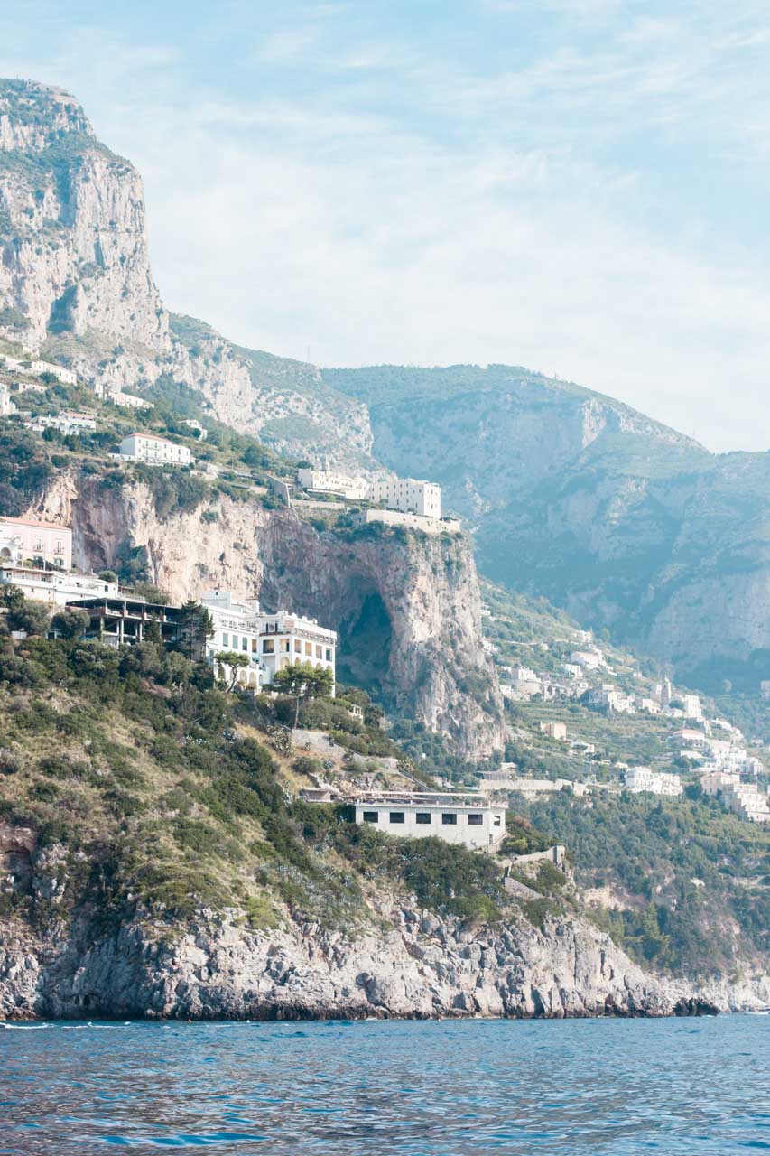 Hillside houses and the mountains in Positano, Italy seen from the ferry to Salerno