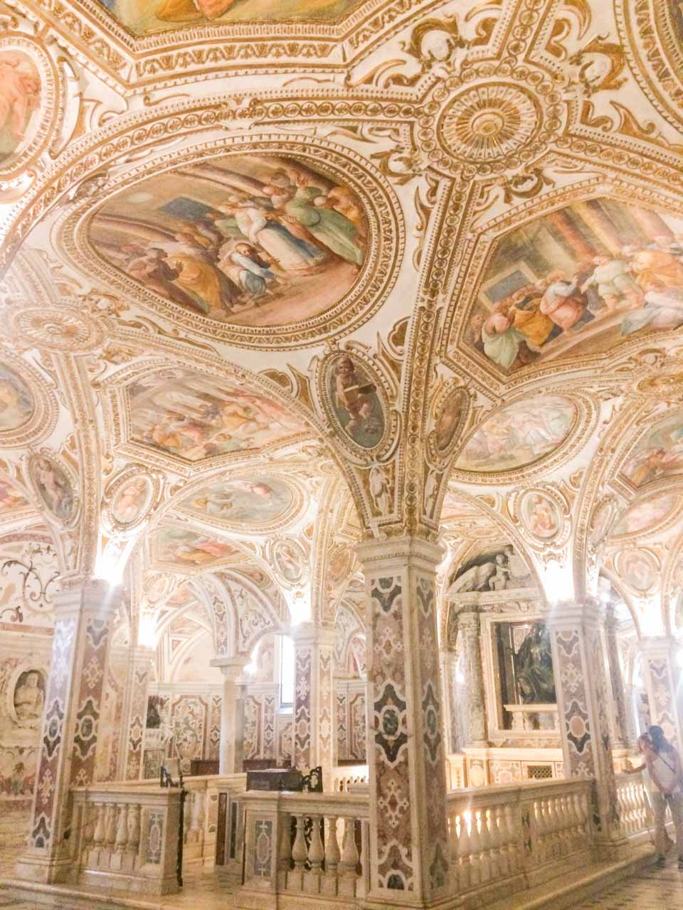 Lavish columns inside the crypt that houses the relics of Saint Matthew in Salerno, Italy