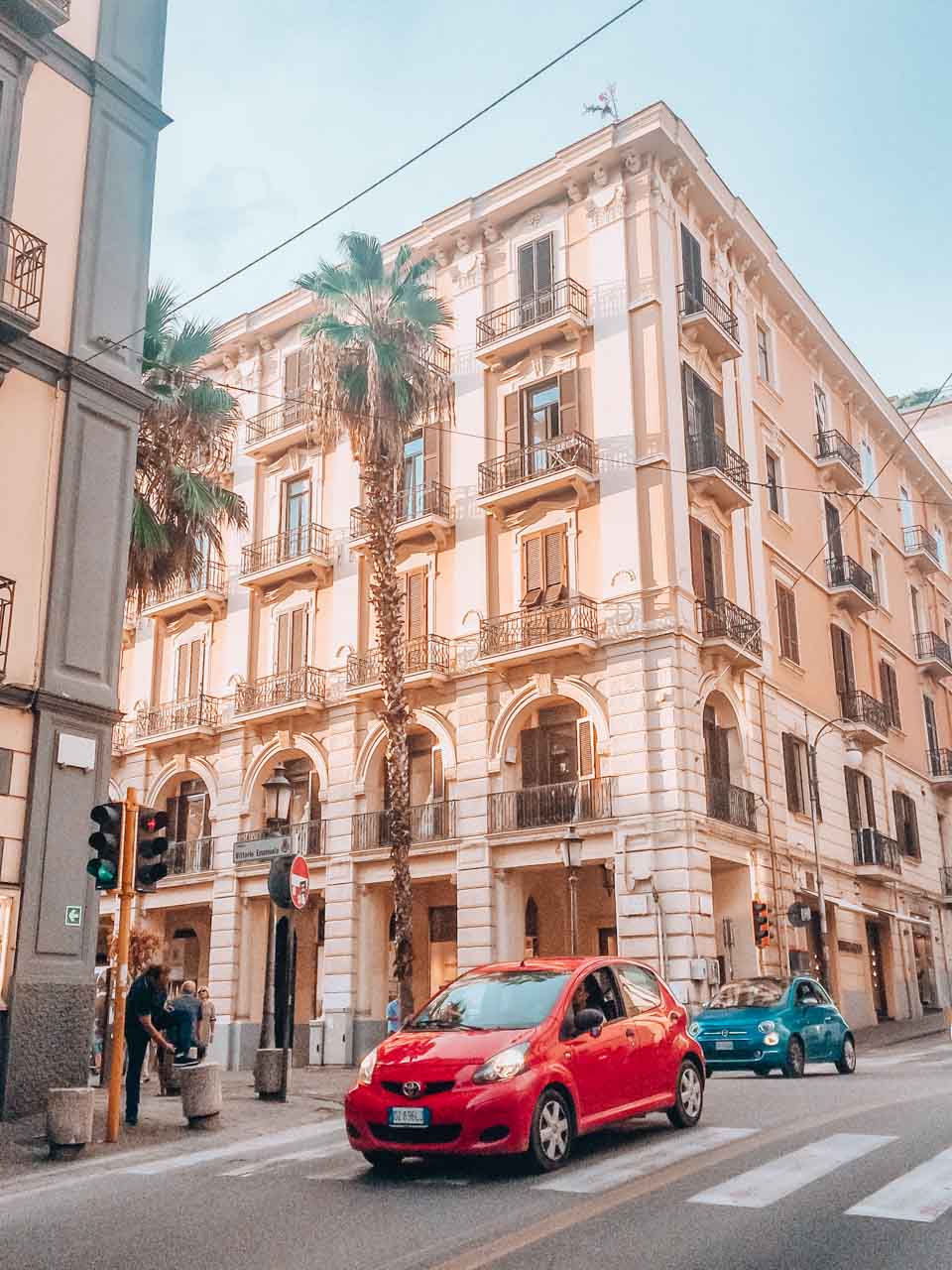 Cars driving down the street in Salerno, Italy