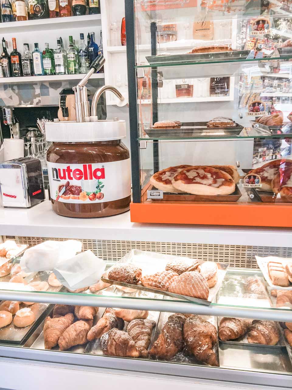 Pastries and a massive jar of Nutella on display inside Marittimo Bar Tobacco and Coffee in Salerno