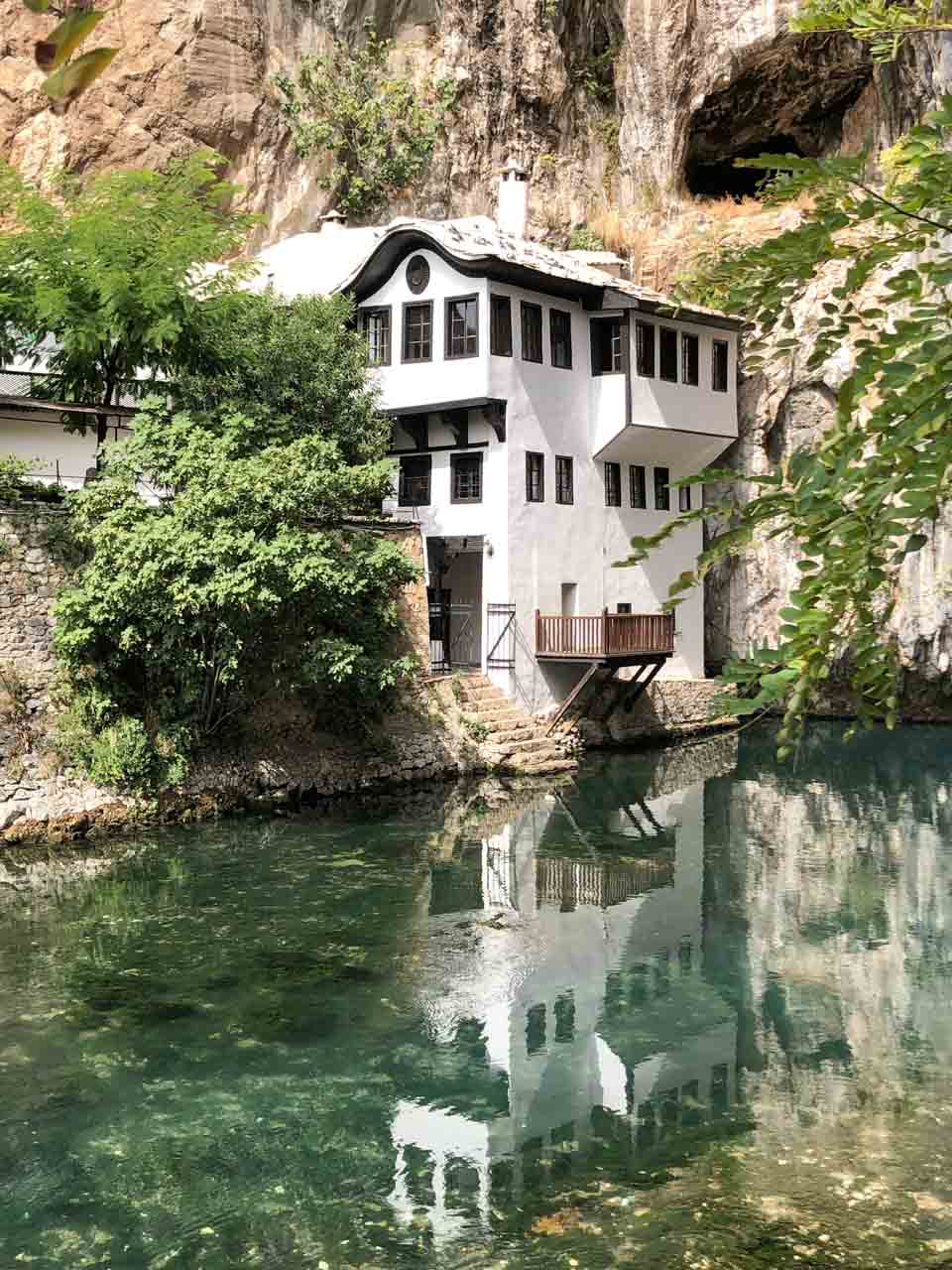 Blagaj Tekija monastery reflecting in the water