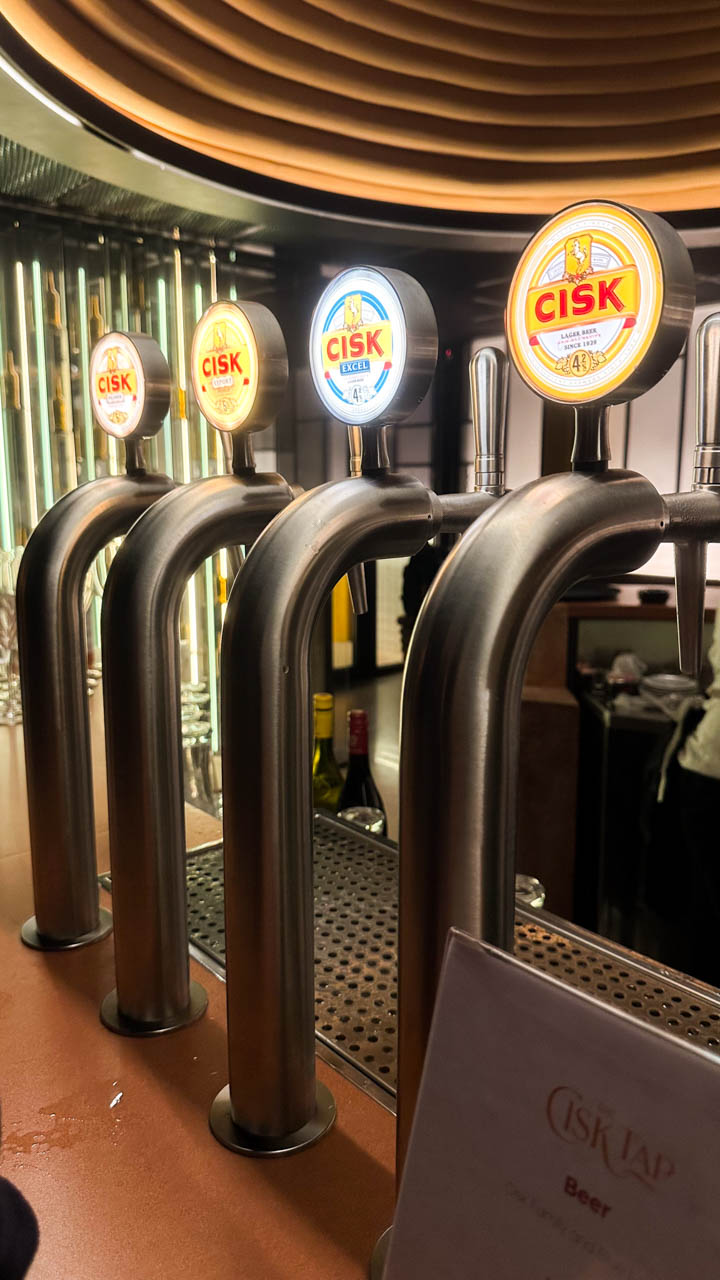 A close-up shot of beer taps at the Cisk Tap in Malta