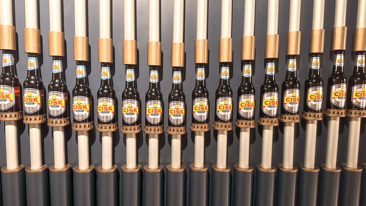 A row of Cisk beer bottles on display at the Farsons Brewery Experience in Malta