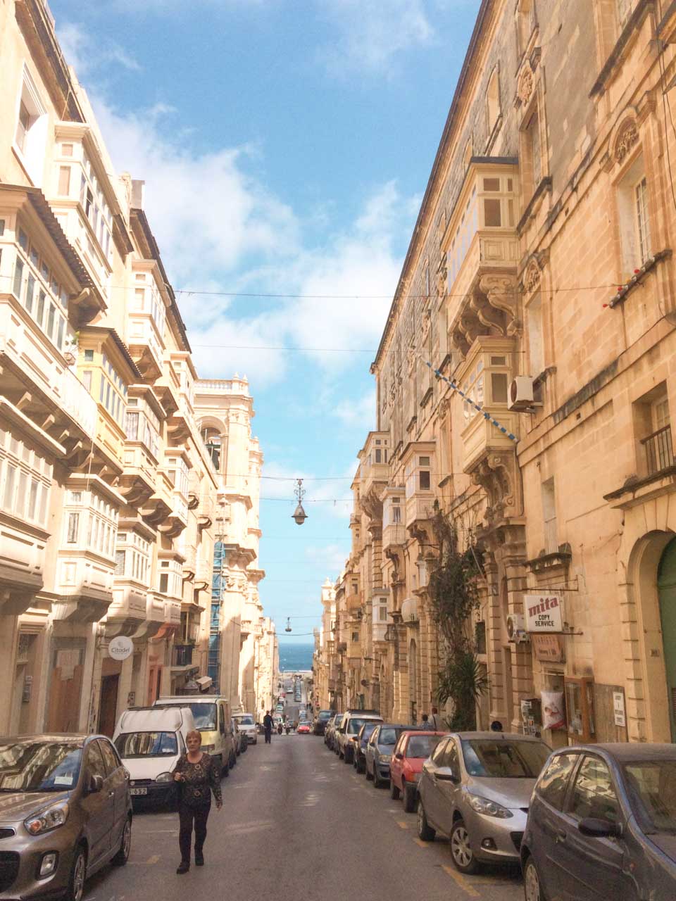 A street in Valletta, Malta lined with cars