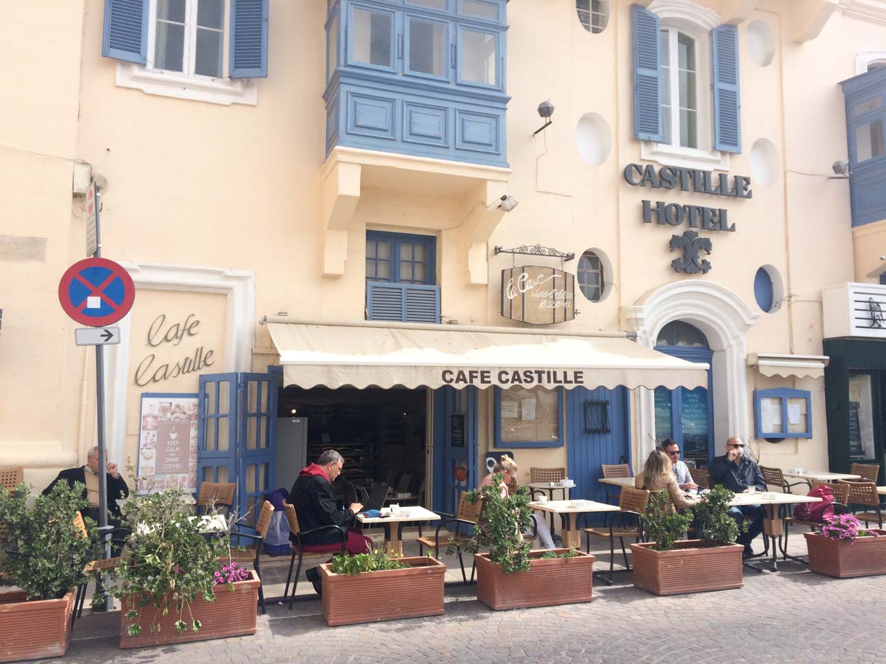 People sitting outside Cafe Castille in Valletta, Malta