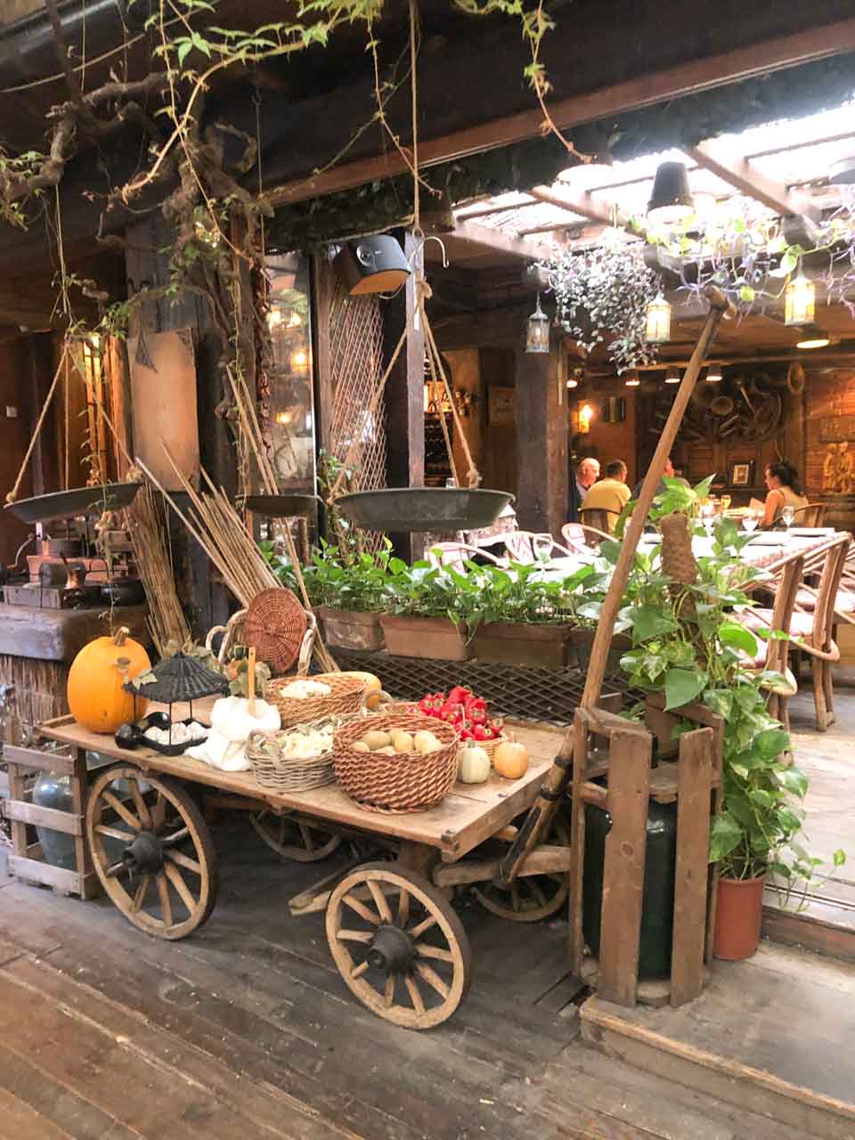 Wooden cart with different autumn decorations inside Liburnia Restaurant in Pristina, Kosovo