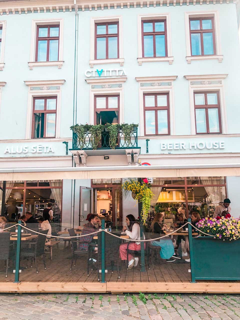 People sitting outside a Lido restaurant in Riga Old Town