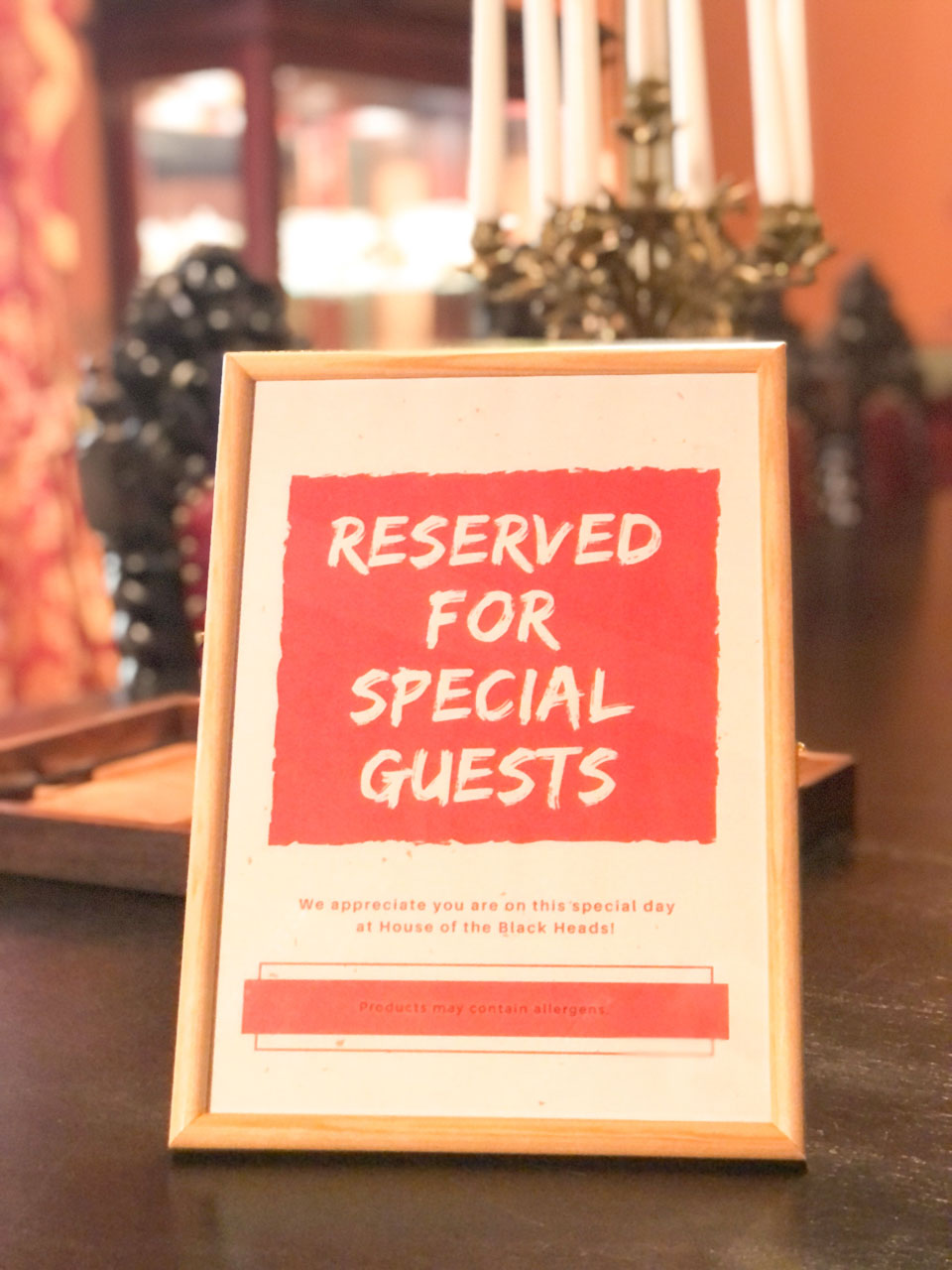 A framed sign that says "Reserved for special guests"