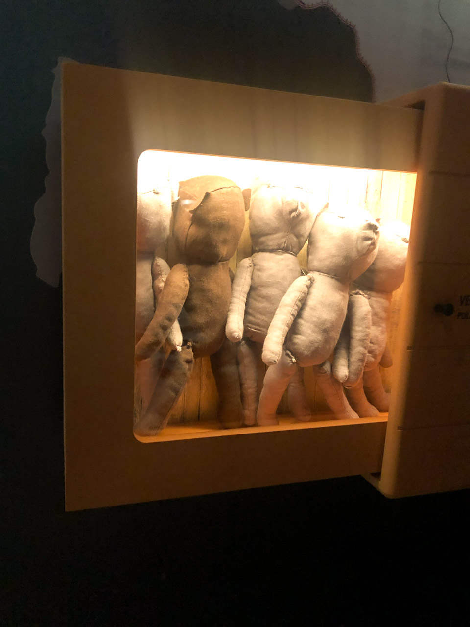 Five brown teddy bears on display at the Museum of the Occupation of Latvia
