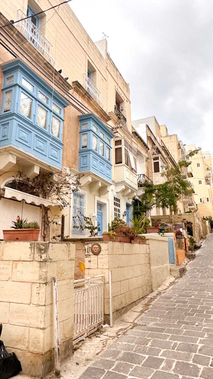 Traditional Maltese houses with blue wooden balconies in Sliema