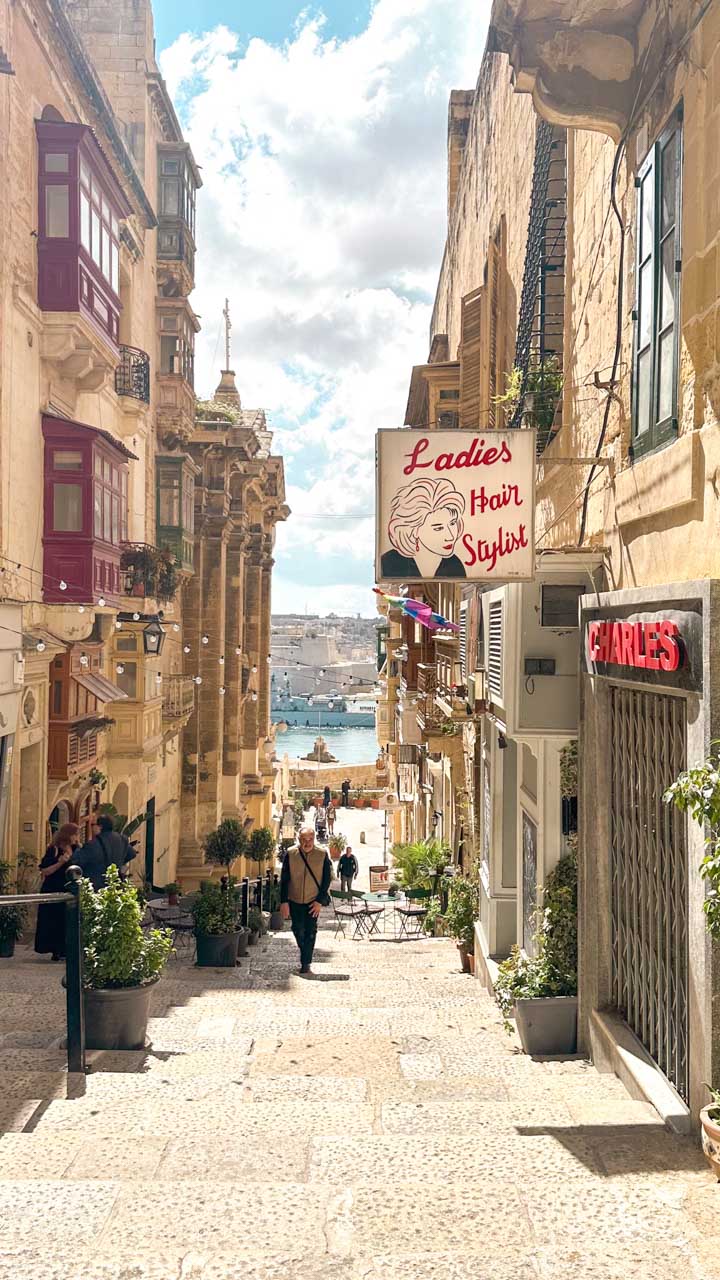 Triq San Gwann street in Valletta, Malta with steps leading down to the Grand Harbour