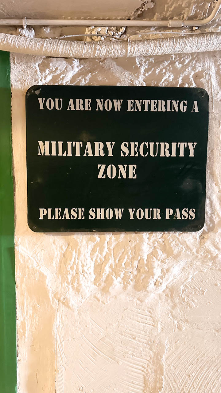 Sign next to the entrance to Lascaris War Rooms in Valletta that says "You are now entering a military security zone. Please show your pass"
