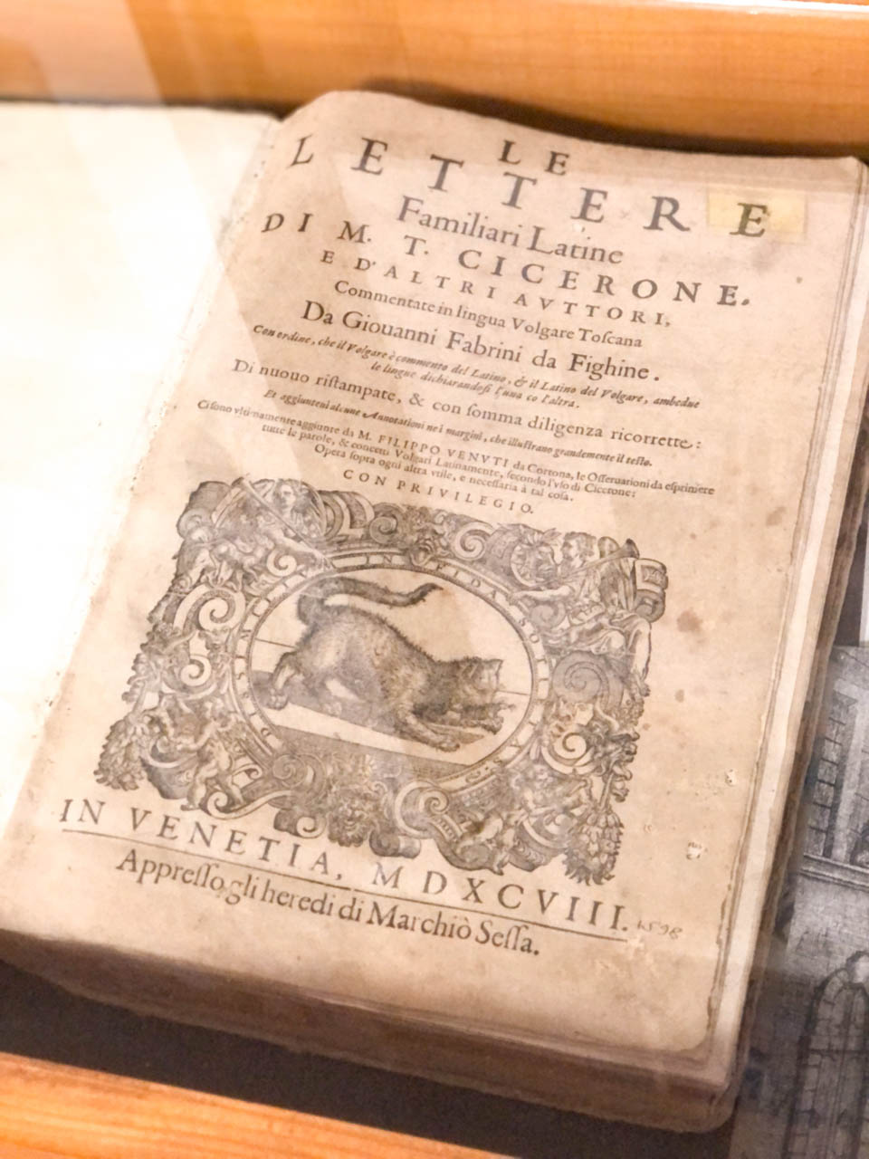 An old book with a cat on the title page on display at the Cat Museum in Kotor, Montenegro