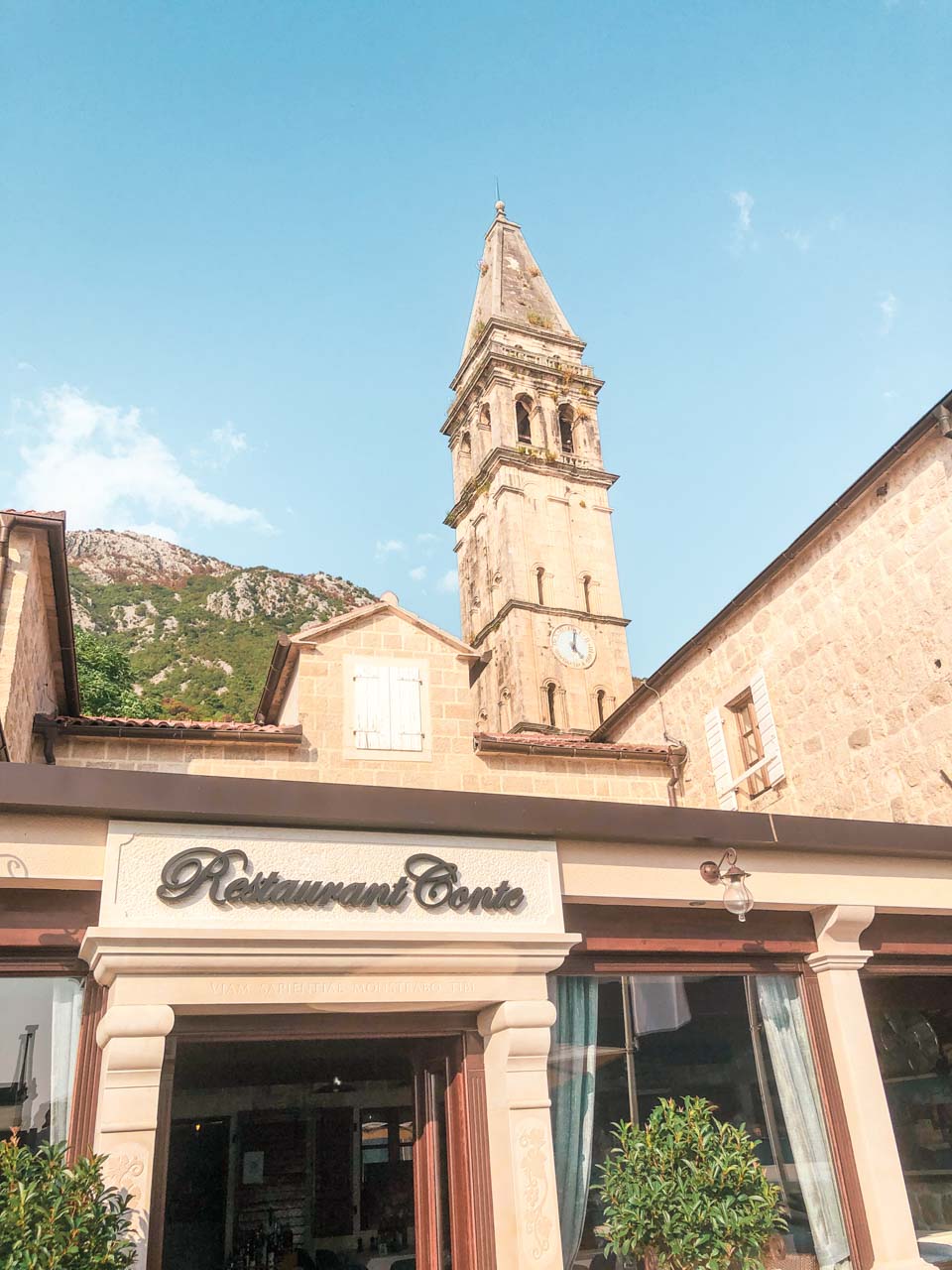 Restaurant Conte in Perast, Montenegro with the bell tower in the background