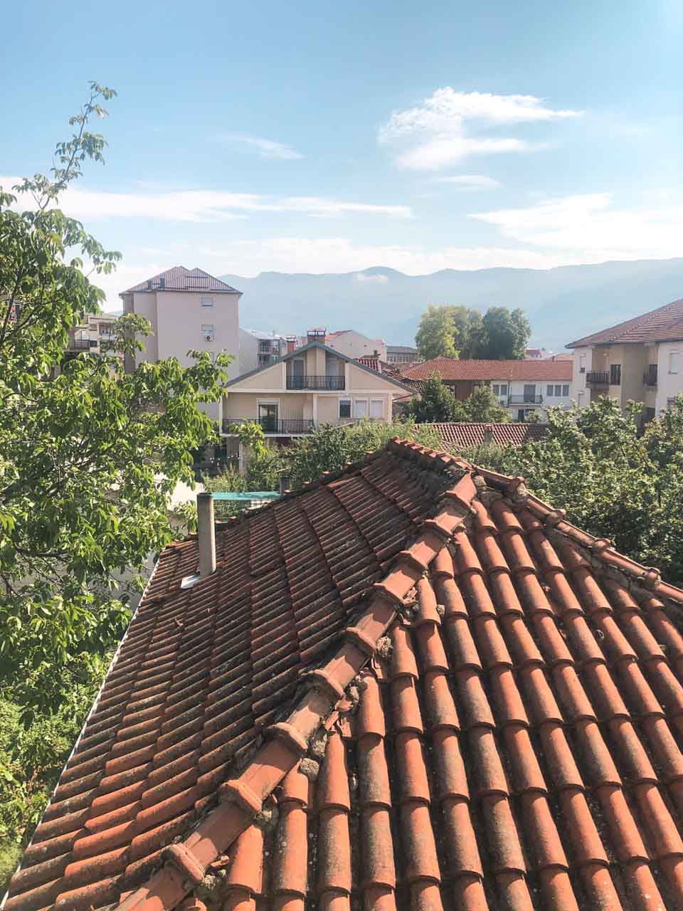 View of the mountains and neighbouring buildings from the balcony of a flat in Ohrid, North Macedonia