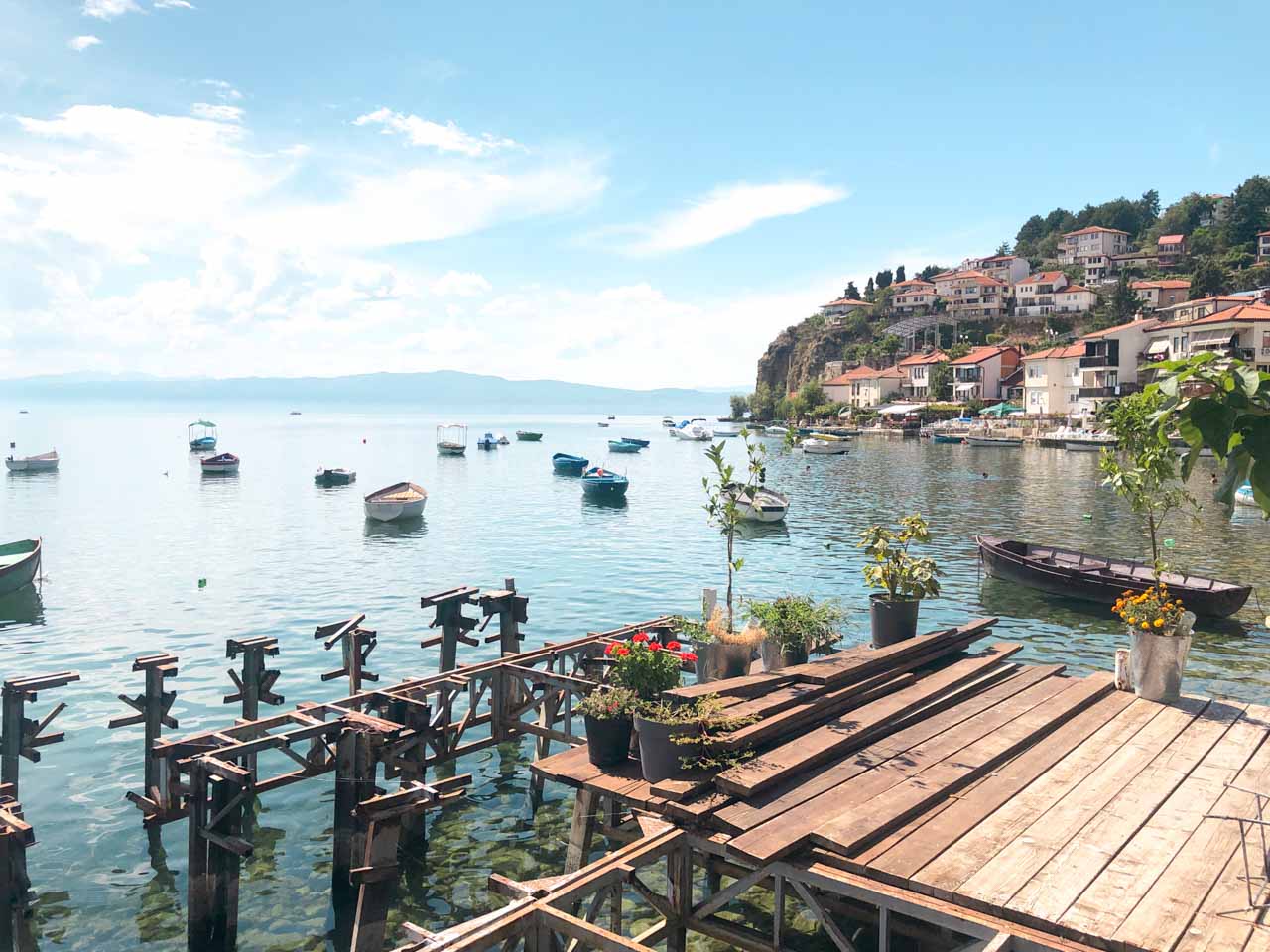 Boats on Lake Ohrid seen from the terrace of Roastery – artisan coffee house in Ohrid, North Macedonia