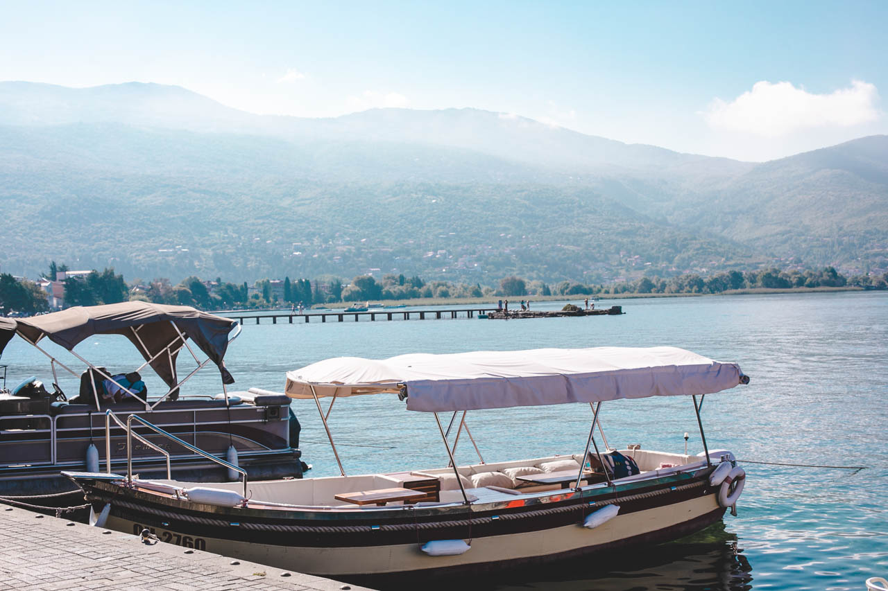 Boats on Lake Ohrid against a mountain backdrop