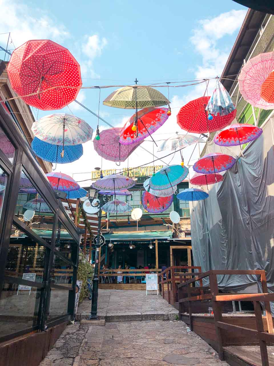 Colourful umbrellas hanging between buildings in the Old Bazaar in Skopje