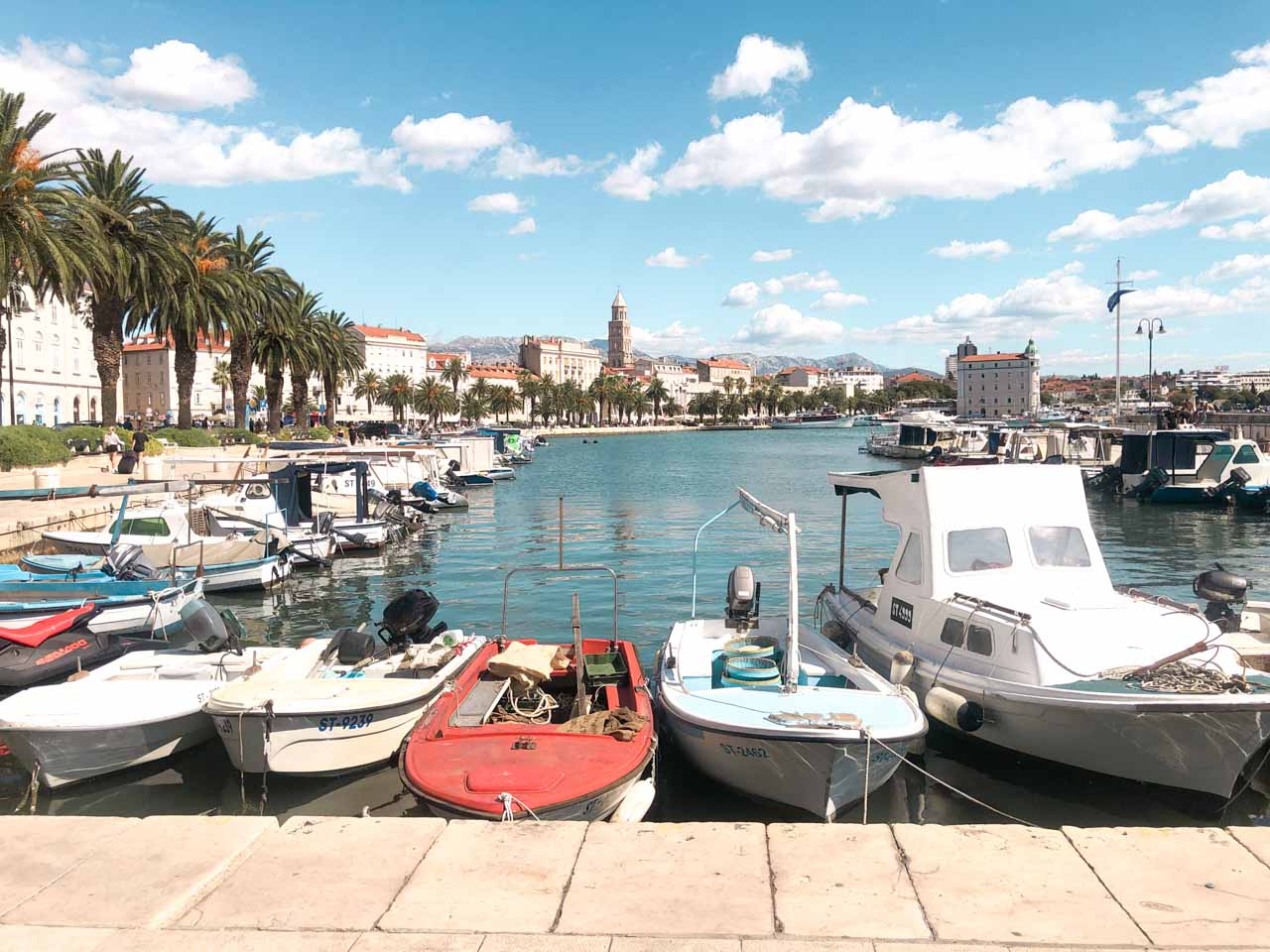 Small boats docked in Riva Harbor - waterfront promenade in Split, Croatia