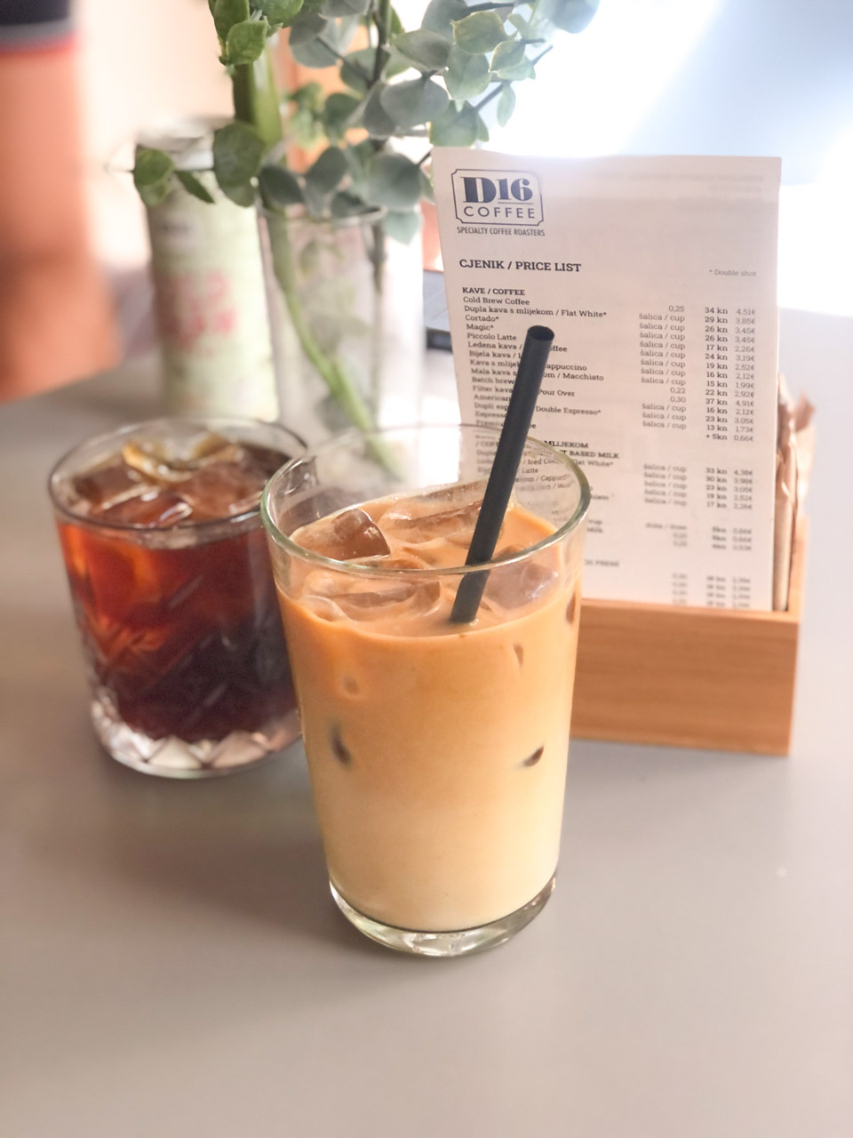 Cold brew coffee and an iced latte on a table at D16 Coffee - specialty coffee roasters in Split, Croatia