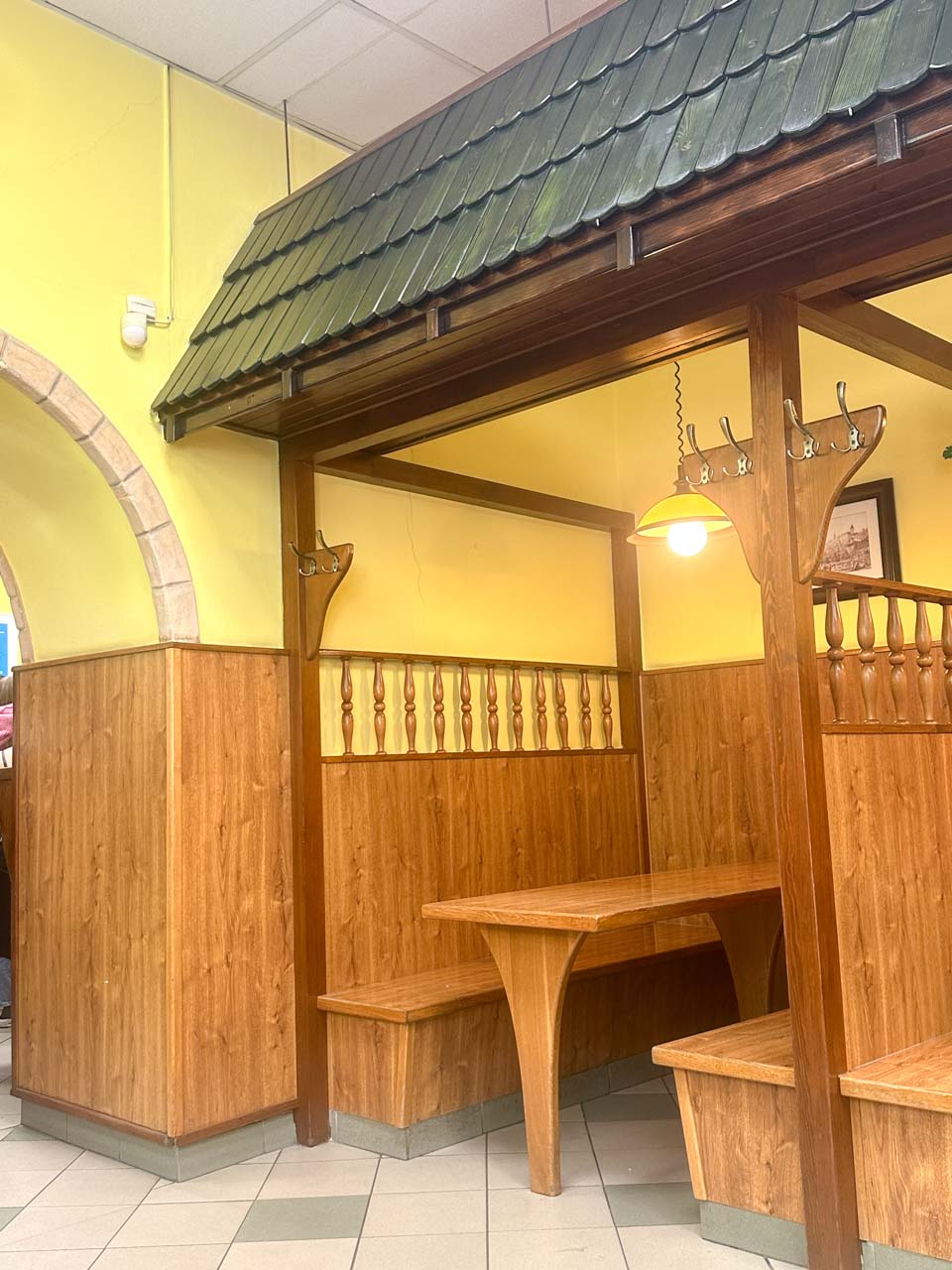 Wooden booths inside the Havelská Koruna restaurant in Prague
