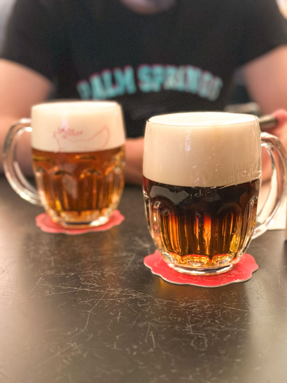 Two glasses of beer on a table