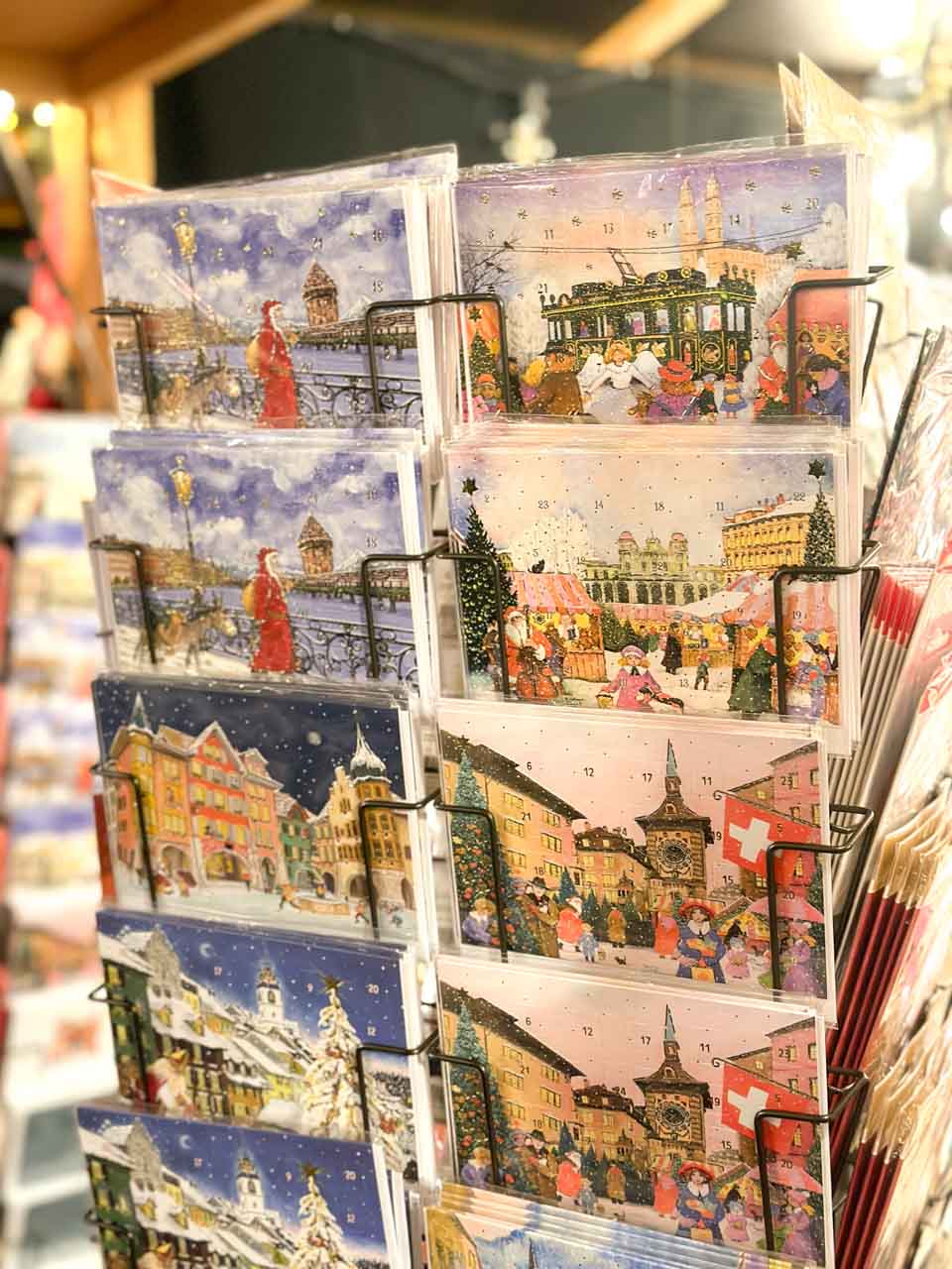 A selection of colourful Christmas postcards on display at the Münsterplatz Christmas market in Basel