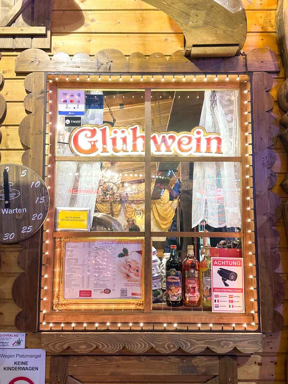A stall with a sign saying 'Glühwein' selling mulled wine at the Basel Christmas market on Barfüsserplatz