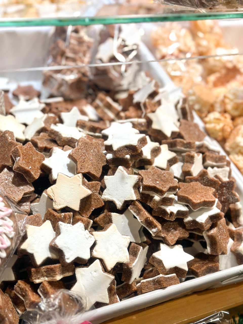 Zimtsterne, or cinnamon stars, with white icing for sale at the Basel Christmas market on Barfüsserplatz
