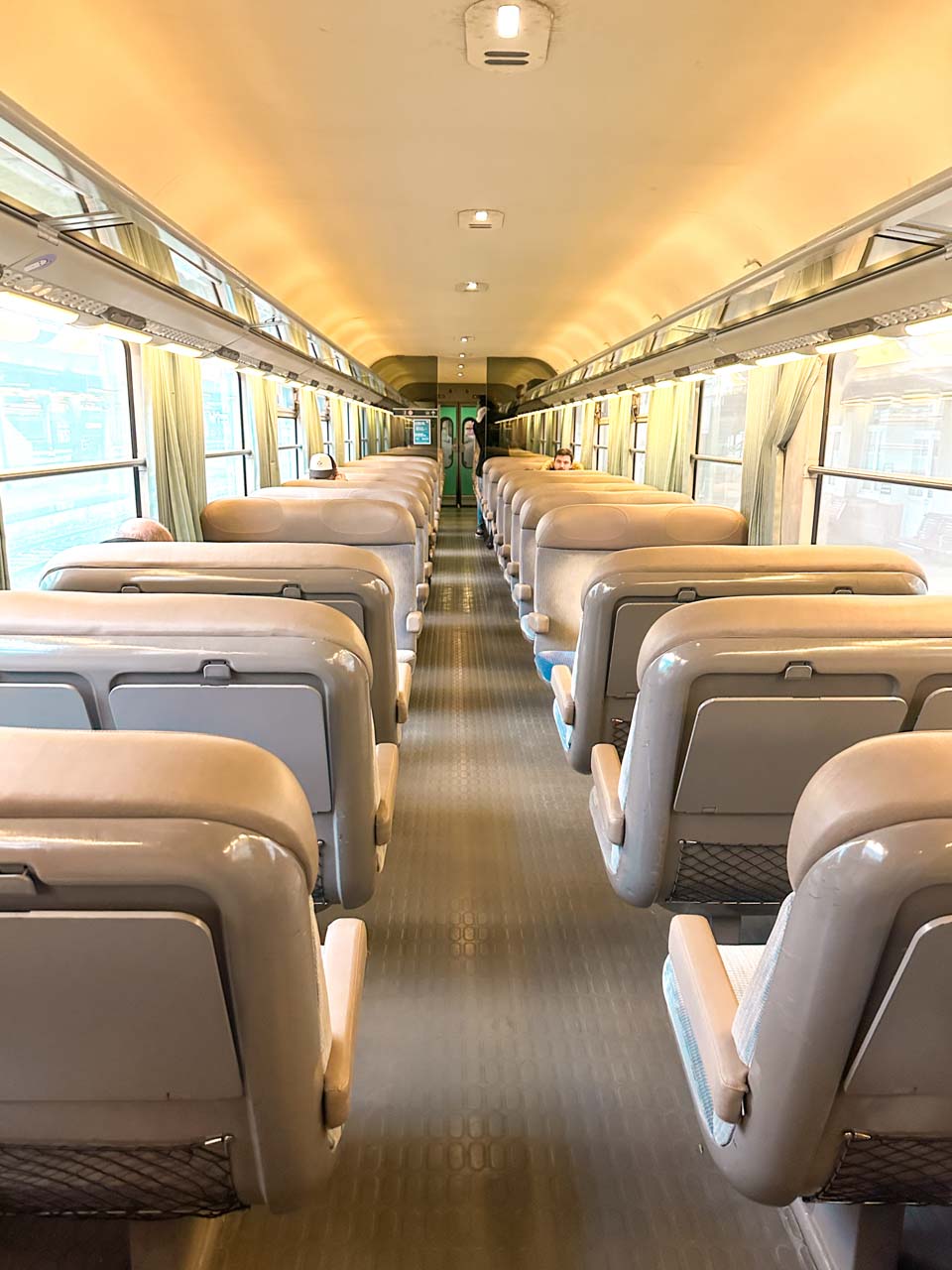 Inside view of a French train carriage with rows of empty seats
