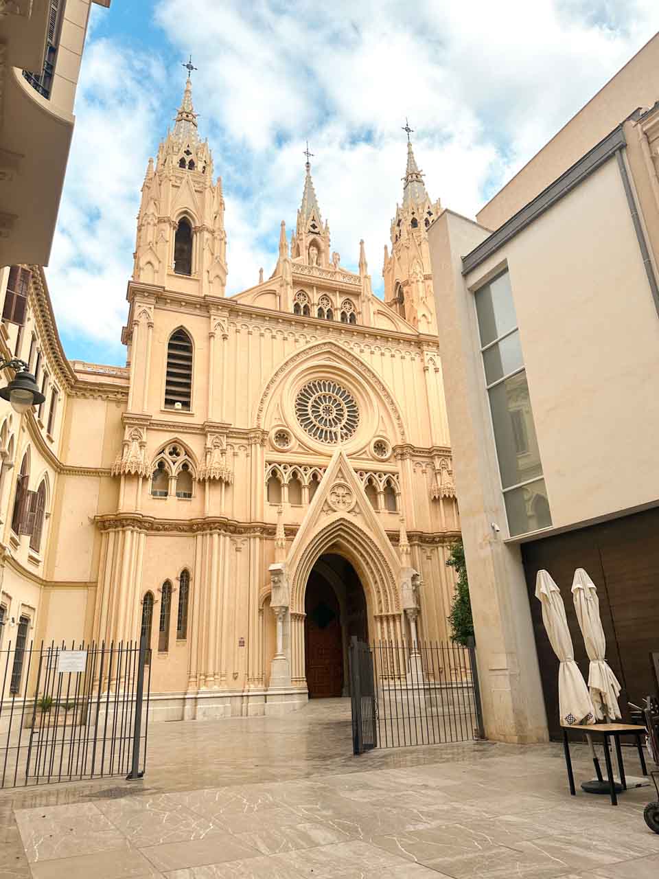 Sacred Heart Church in Malaga, Spain set against a cloudy sky