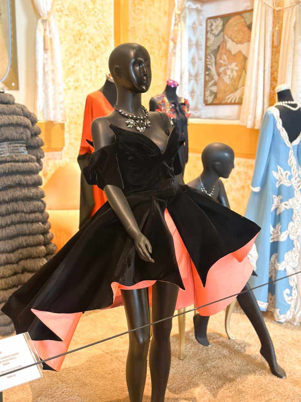 A mannequin dressed in a black and pink Thierry Mugler dress with a statement necklace at the Automobile and Fashion Museum in Malaga, Spain