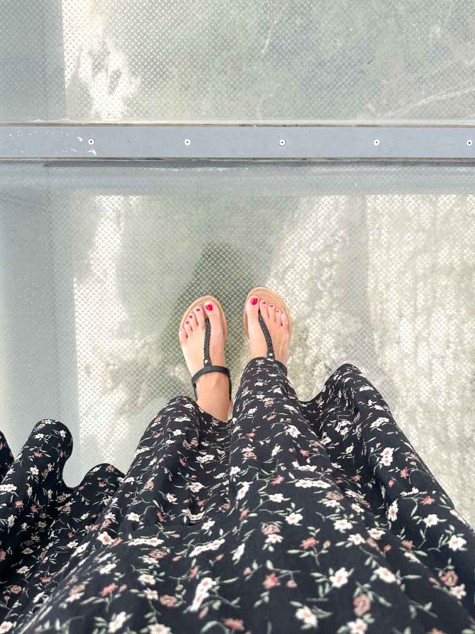 A woman's feet on a glass-bottomed Skywalk inside the Upper Nature Reserve in Gibraltar