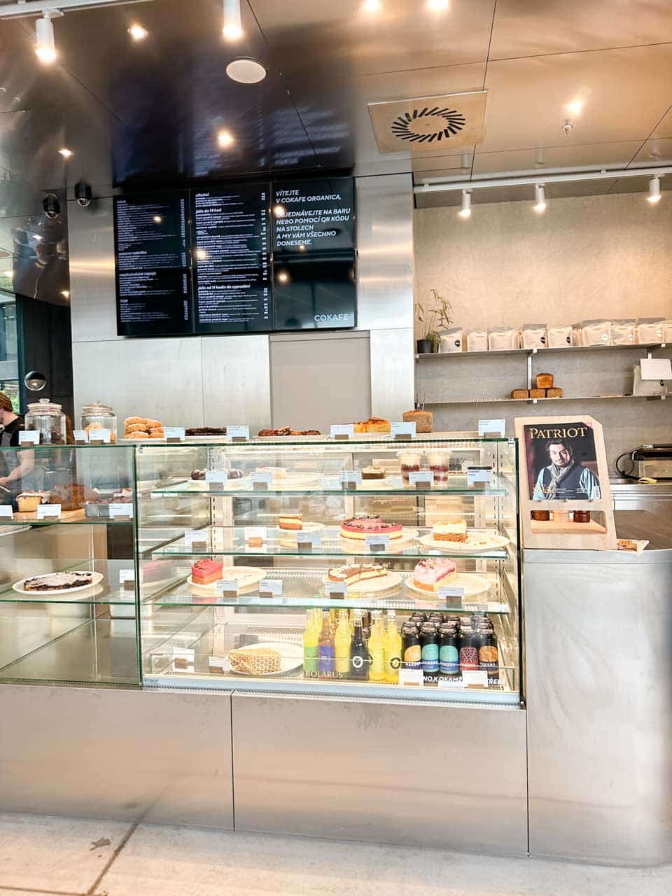 Interior of the Cokafe cafe in Ostrava with a display case of assorted cakes