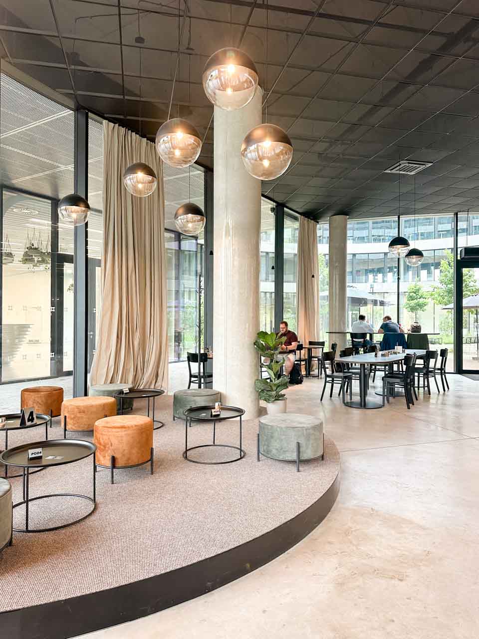 The interior of Cokafe cafe in Ostrava with circular lights and stylish seating