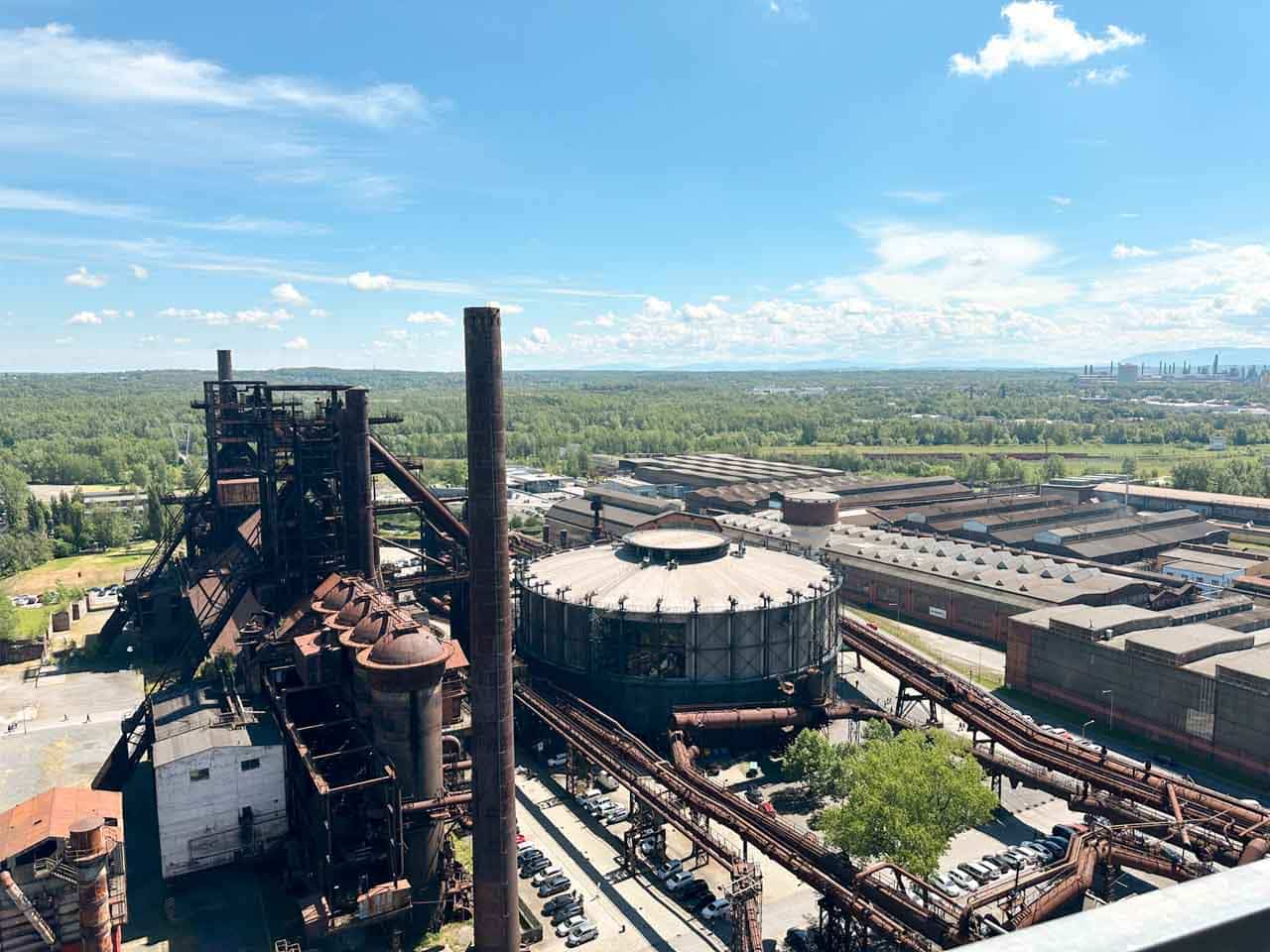 Wide view of the Dolní Vítkovice industrial complex under a clear sky seen from the top of Bolt Tower