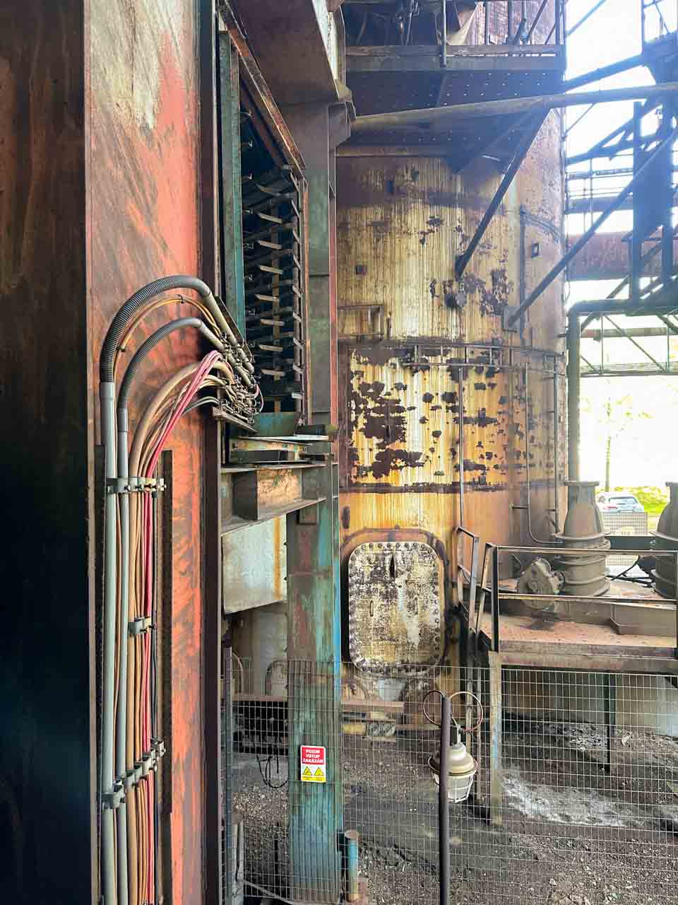 Detailed view of rusted equipment and piping inside the Bolt Tower in Ostrava
