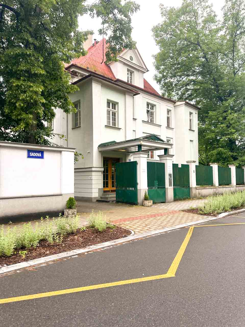 View of Retro Hotel Villa Ostrava with lush green trees around it