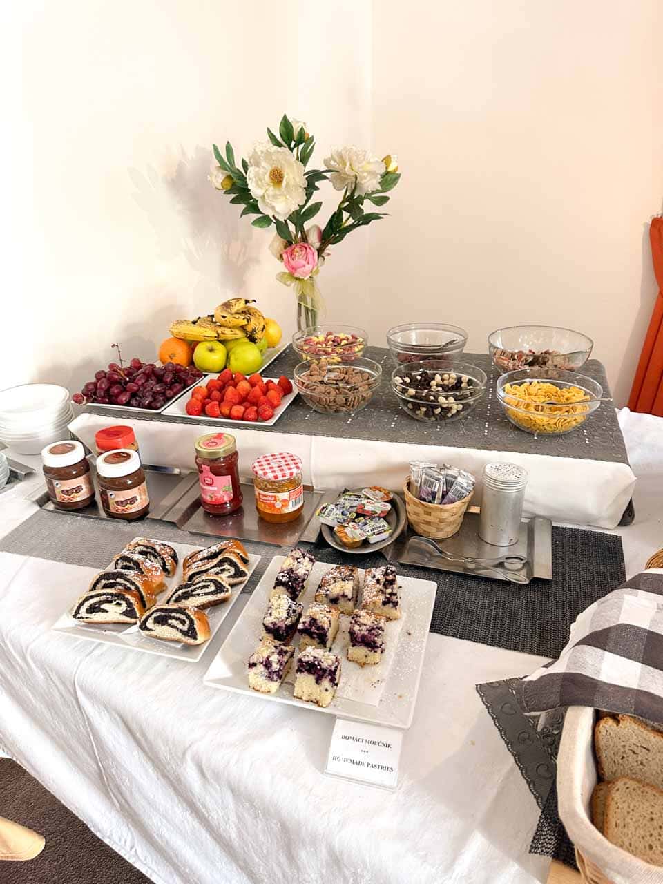 A well-arranged breakfast buffet with fresh fruits and pastries at Retro Hotel Villa Ostrava