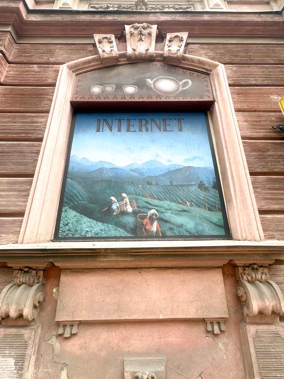 Vintage sign with the word 'Internet' painted on a rustic building façade