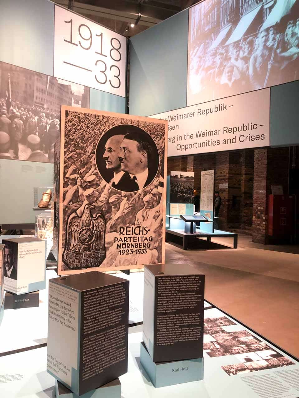 A museum exhibit featuring displays about Nuremberg's history during 1918–1933, with historical posters and educational panels